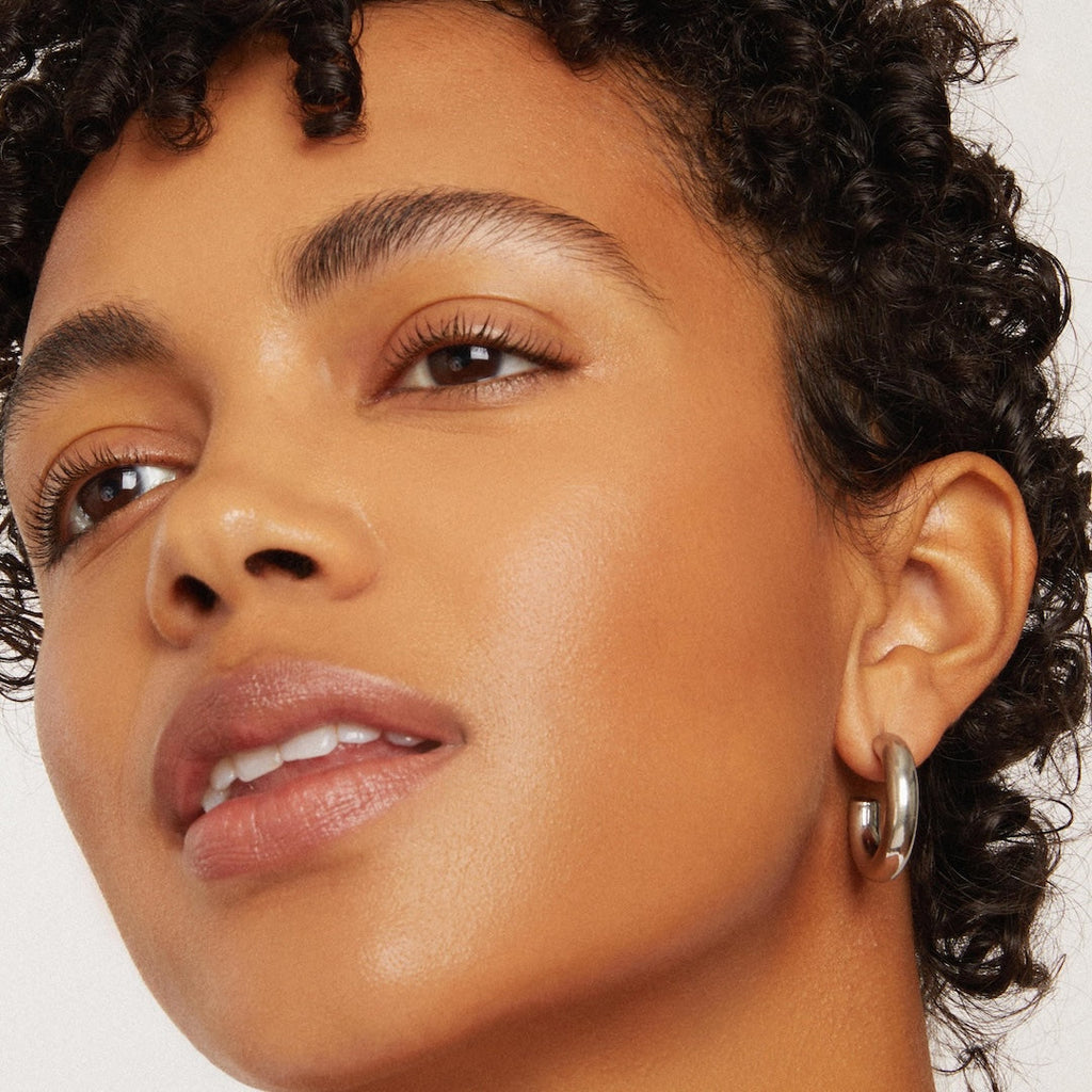 Close-up of a woman's face with a neutral background