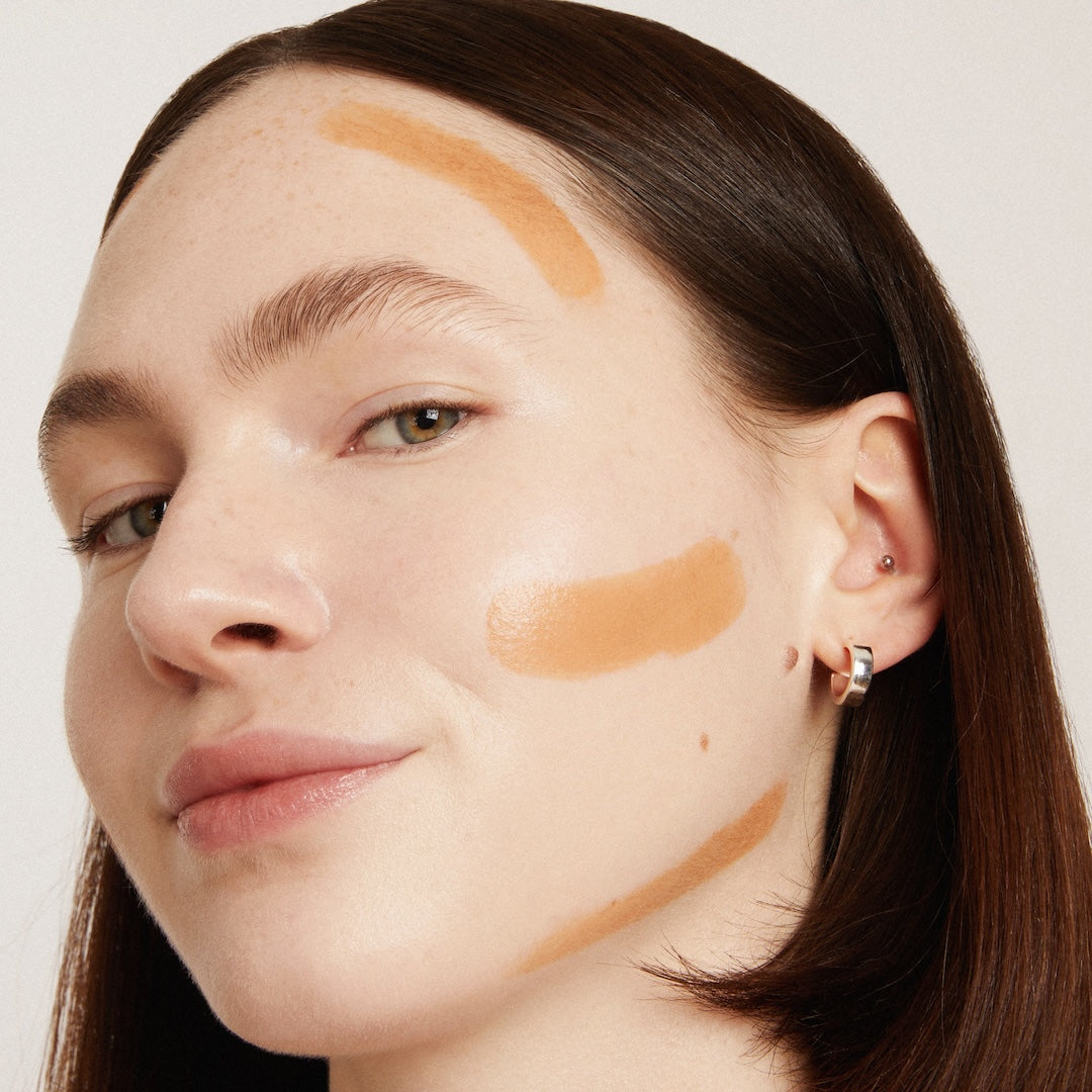 Woman's face with makeup on a neutral background