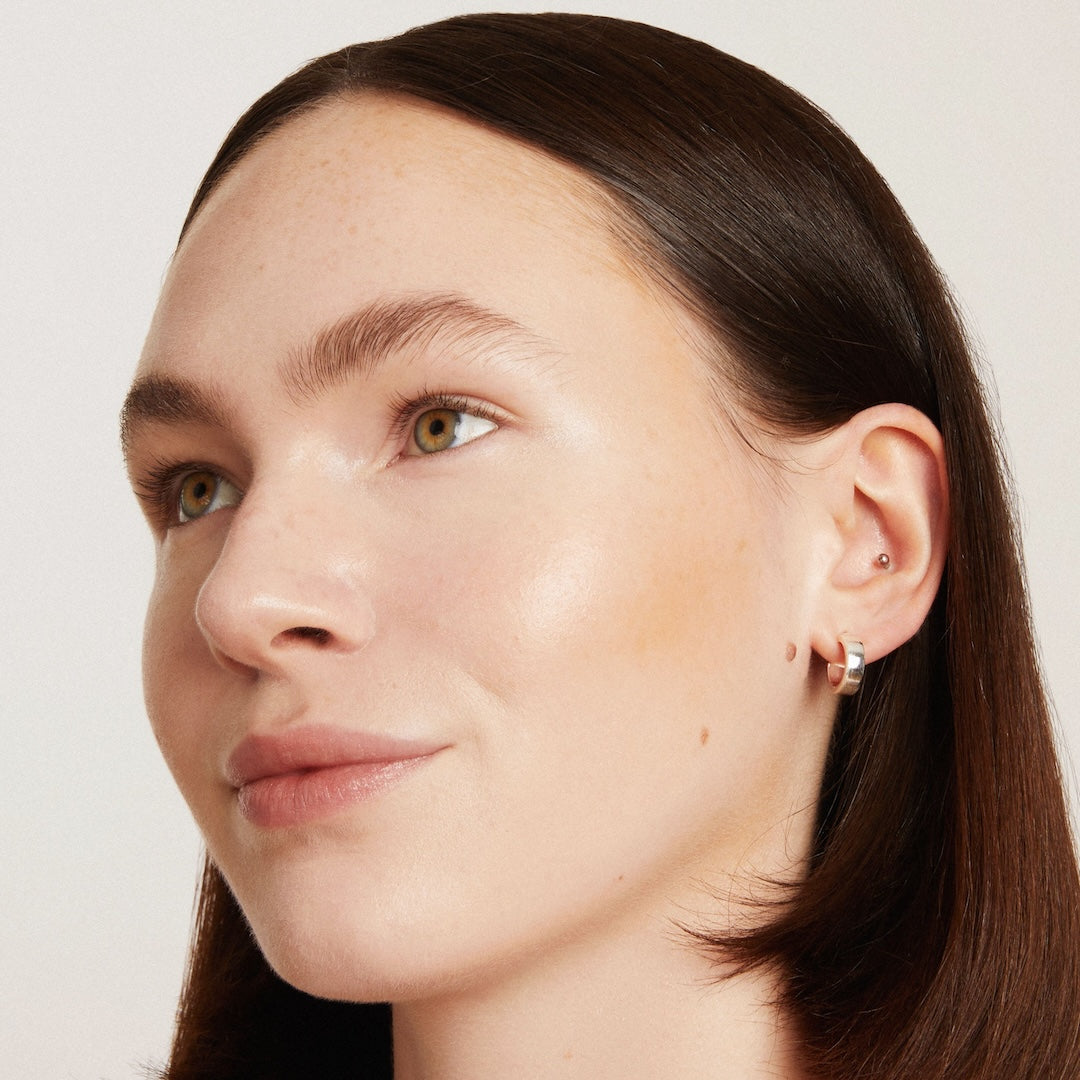 Close-up of a woman's face with a neutral background