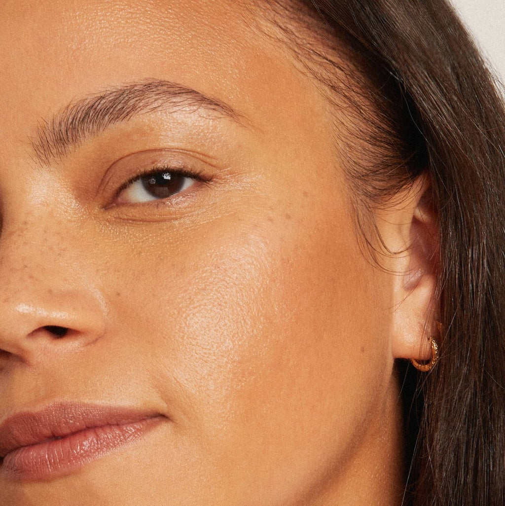 Close-up of a person's face with a focus on the cheek and eye.