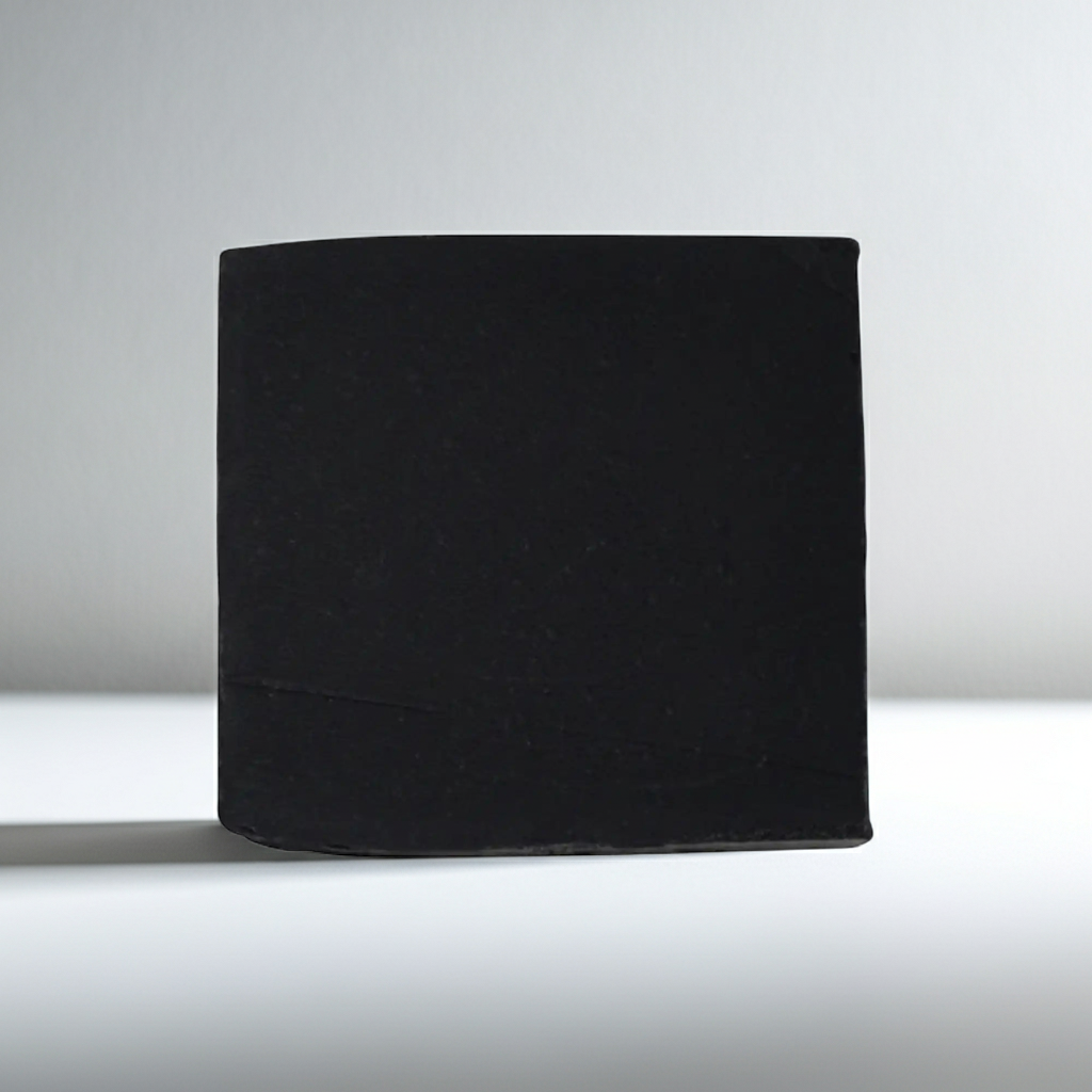 Black soap bar on a white background