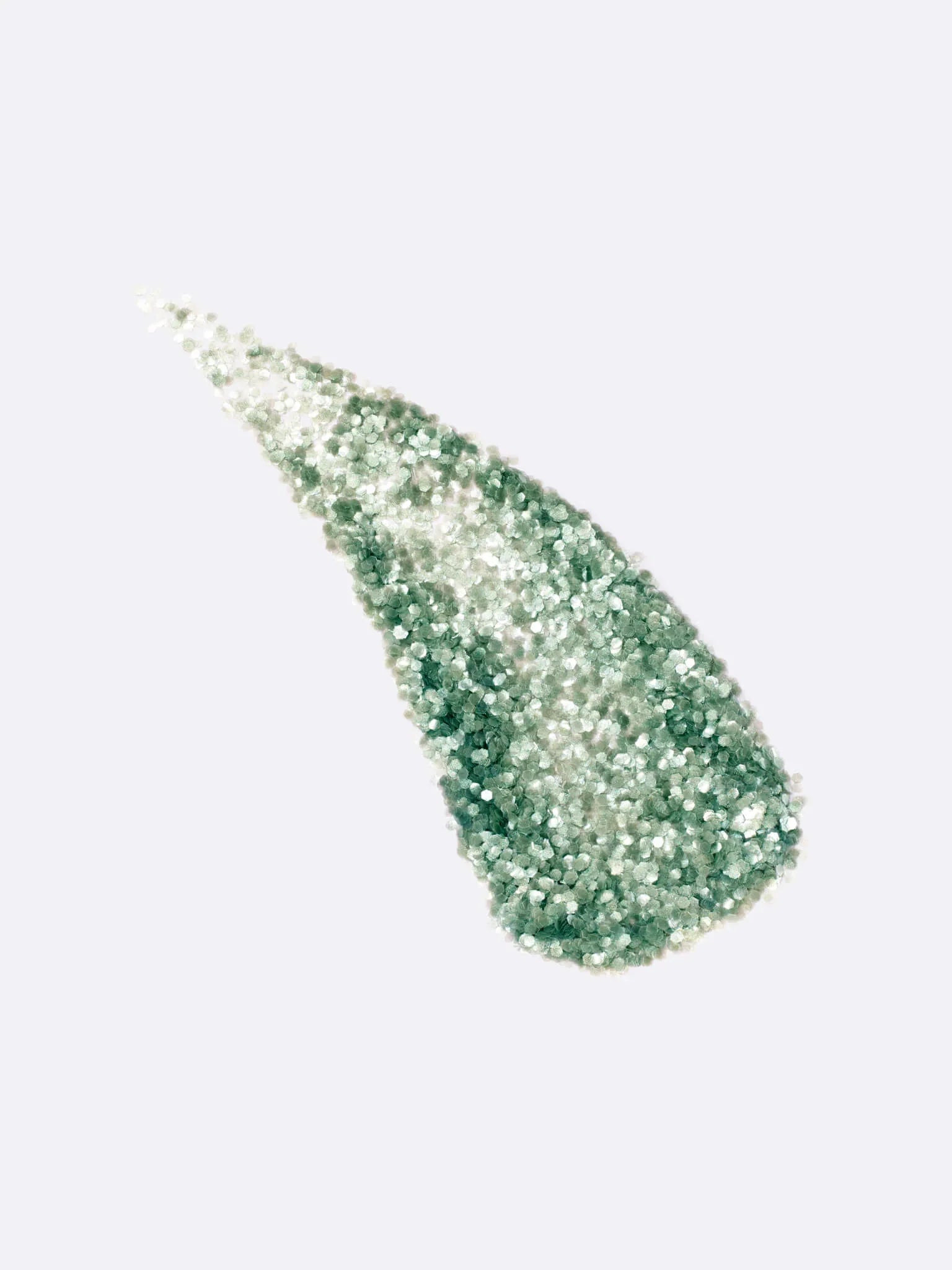 Green glittery makeup swatch on a light gray background