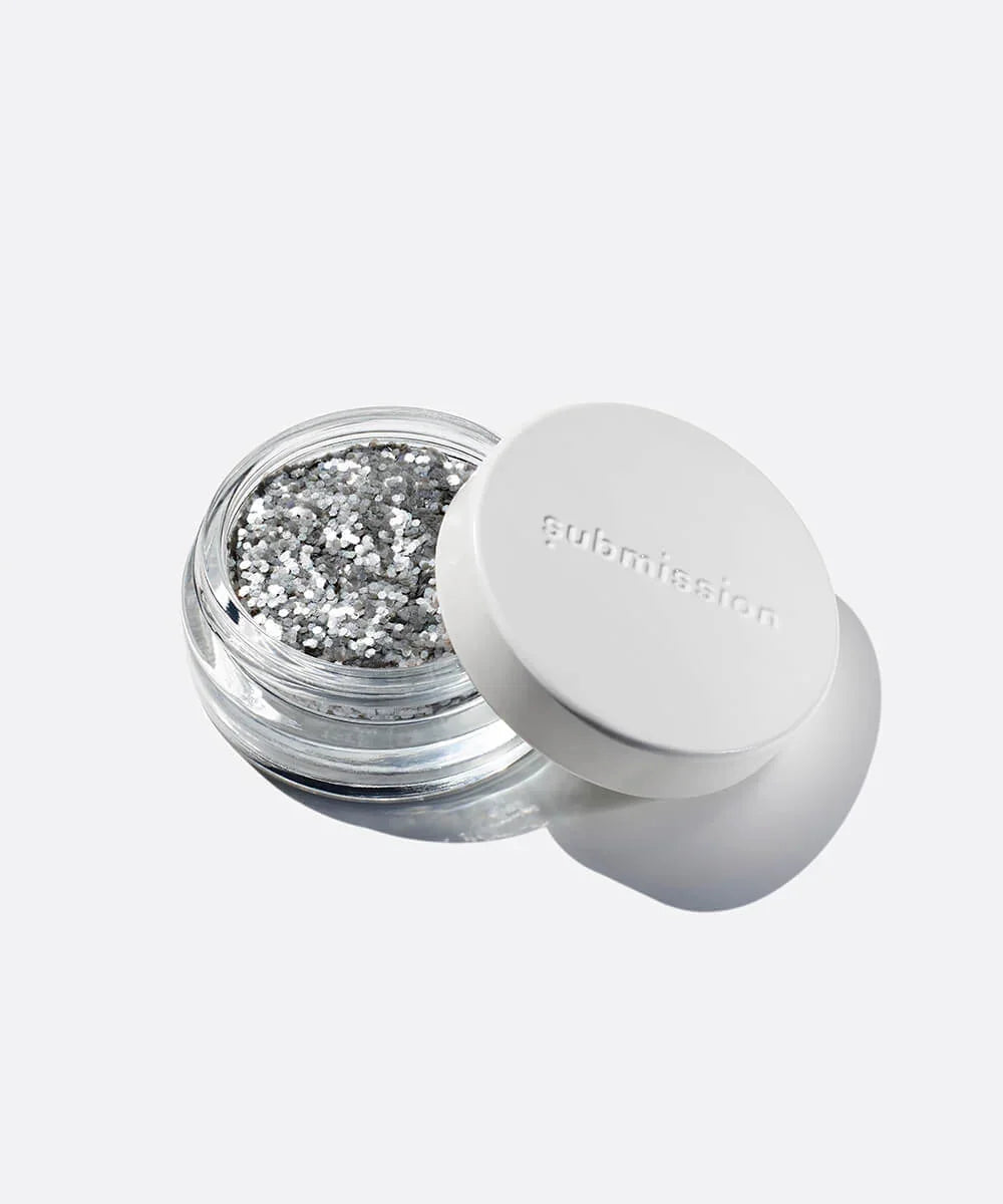 Silver glitter jar with a white lid on a white background